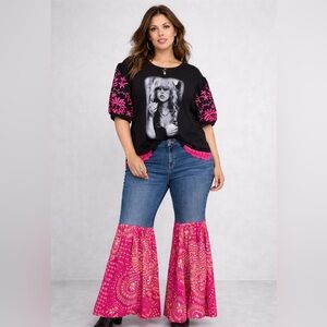 Upcycled denim jeans with hot pink flared bottoms, by Susie.